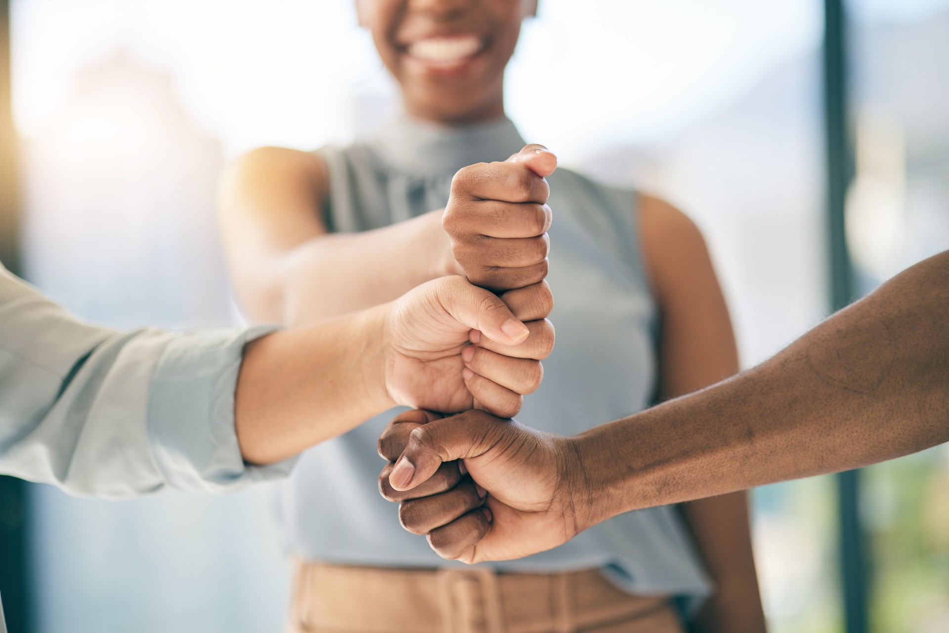 Fist bump stack, support or business people for motivation, teamwork or mission in collaboration. Partnership, hands closeup or employees meeting in huddle with goal, vision or solidarity together